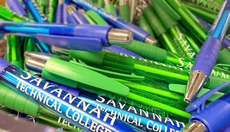 assortment of Savannah Tech branded pens